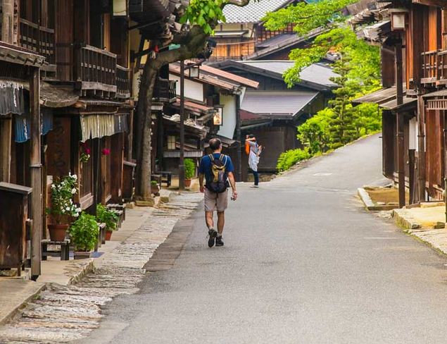 hikers in historic village in Japan
