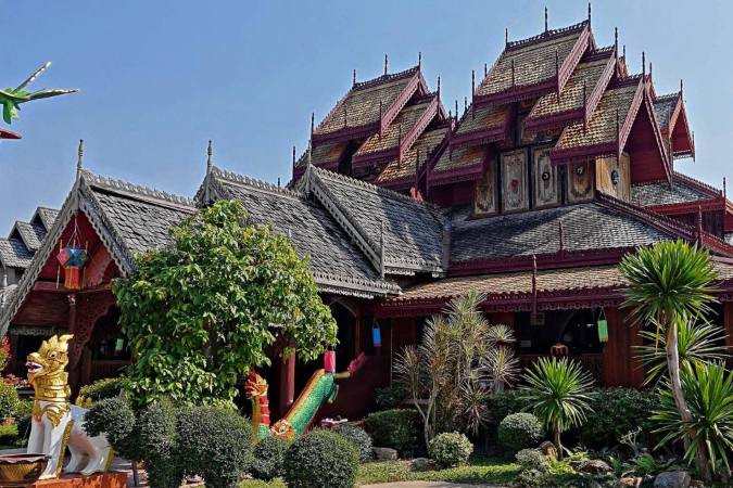 ornate teak temple building in Chiang Kham