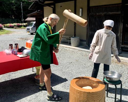 cyclists trying to pound rice for moji